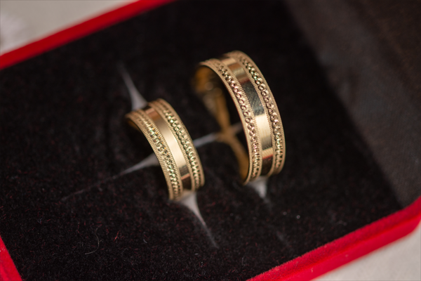 Two 10k gold wedding bands in case